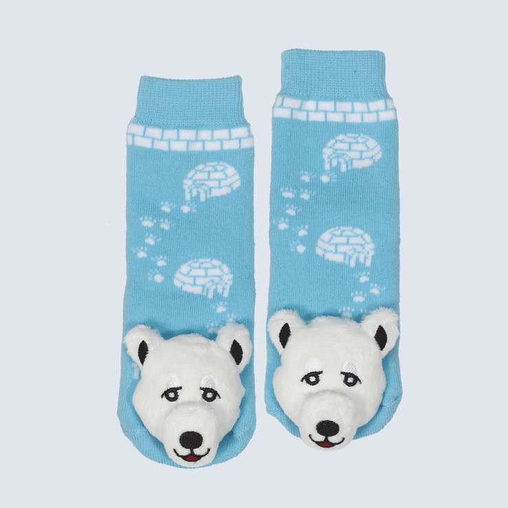 Two blue socks against a white background. The socks feature a white igloo motif and a cute plush polar bear charm on the toe.